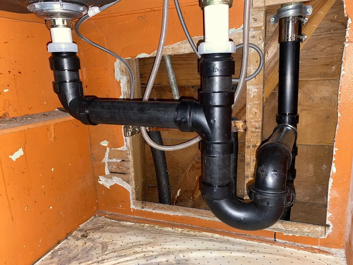 Professional Garbage Disposal Repair equipment and tools on the job in Henderson